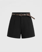 High-rise black tailored shorts with pressed front pleats, front view