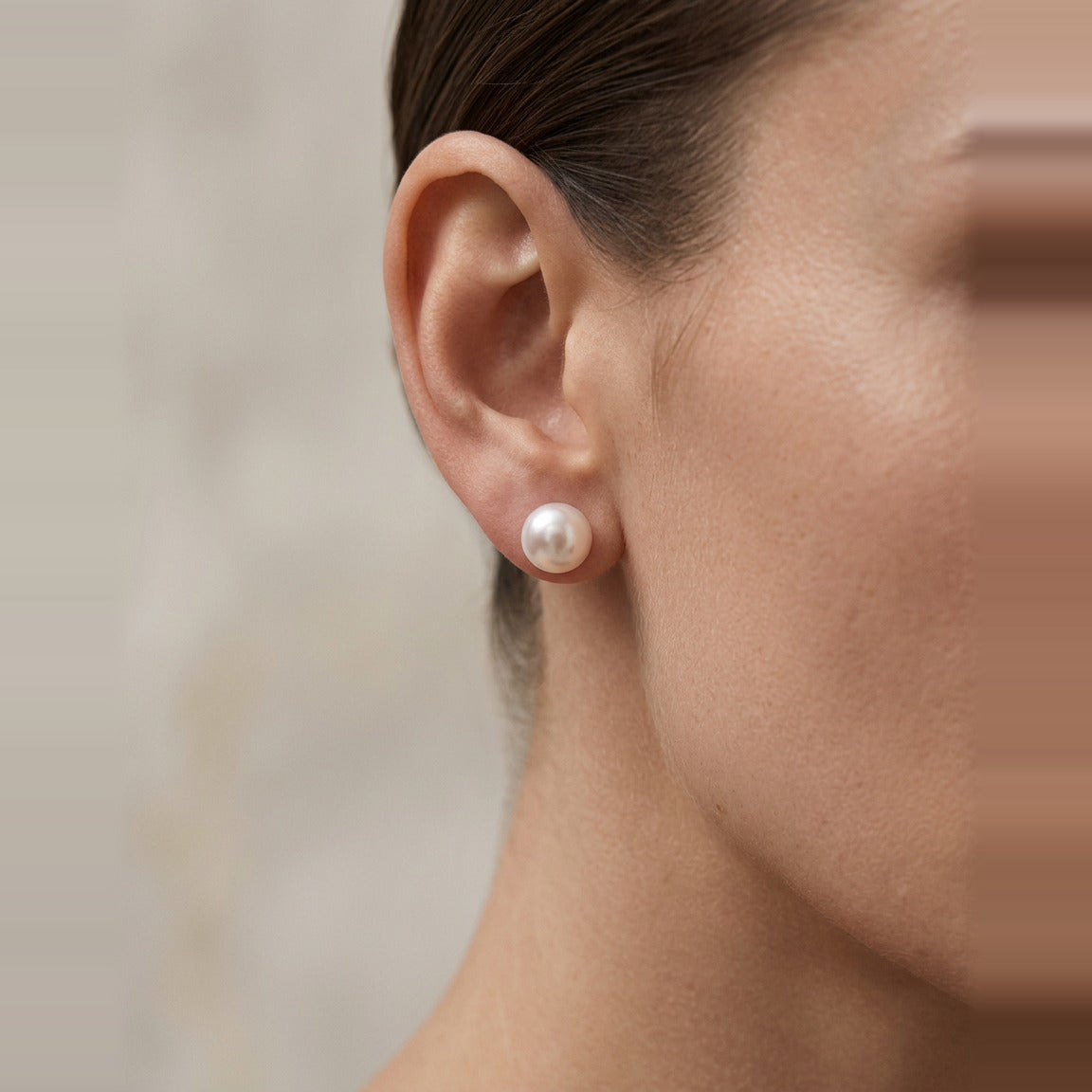 Side view of the Baroque Pearl Stud Earring in Pearl showing the post