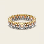 Beaded Stretch Bracelet Trio in Mixed metal, worn stacked on the wrist.