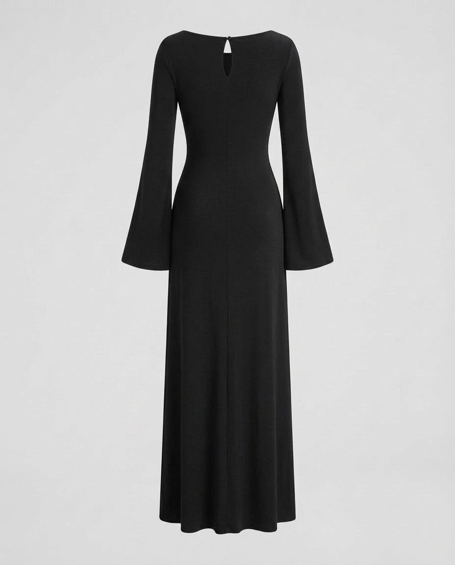 Black trumpet silhouette dress, held close through the body.