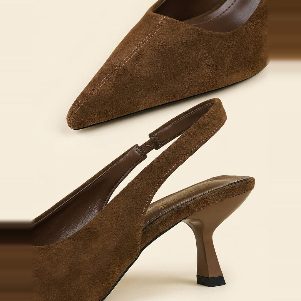 Close-up of the chocolate faux suede surface and elasticated heel strap seam