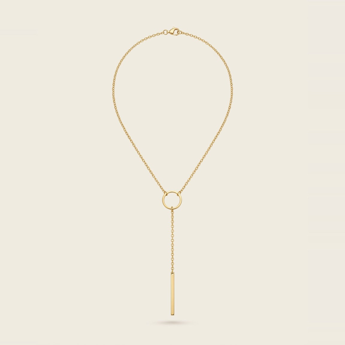 Circle Bar Lariat Necklace in Gold, worn at the collarbone.