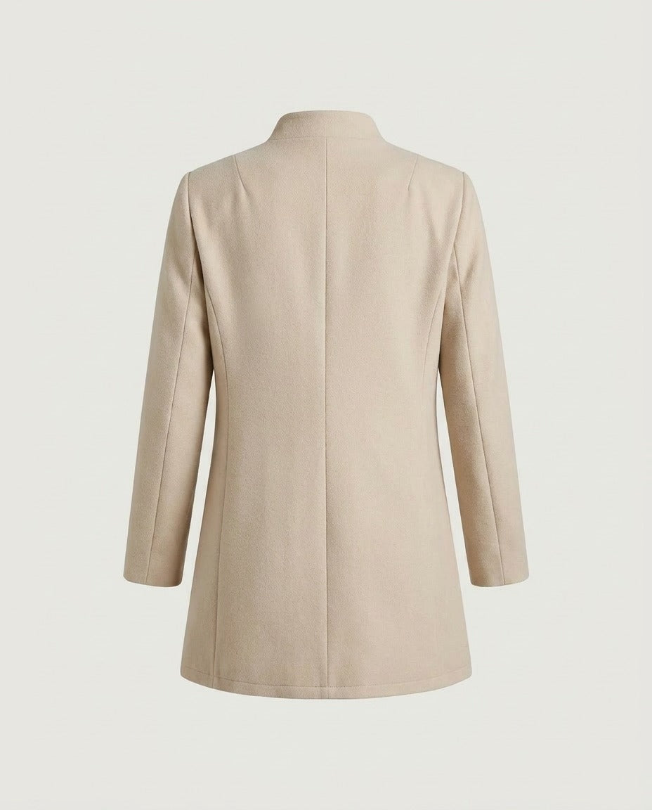 Cream collarless coat from the back showing the straight cut