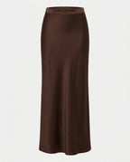 Full length view of the Column Slip Skirt in Chocolate worn with a white t-shirt.