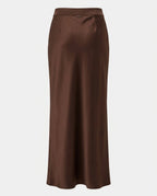 Back view of the Column Slip Skirt in Chocolate showing the clean line of the silhouette.