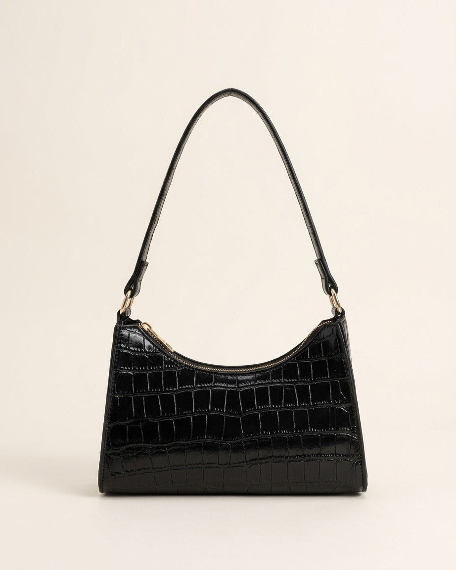 Croc-embossed baguette shoulder bag in black against a neutral background.