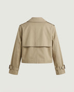 Back view of cropped trench jacket in camel showing clean shoulder line and cropped hem.
