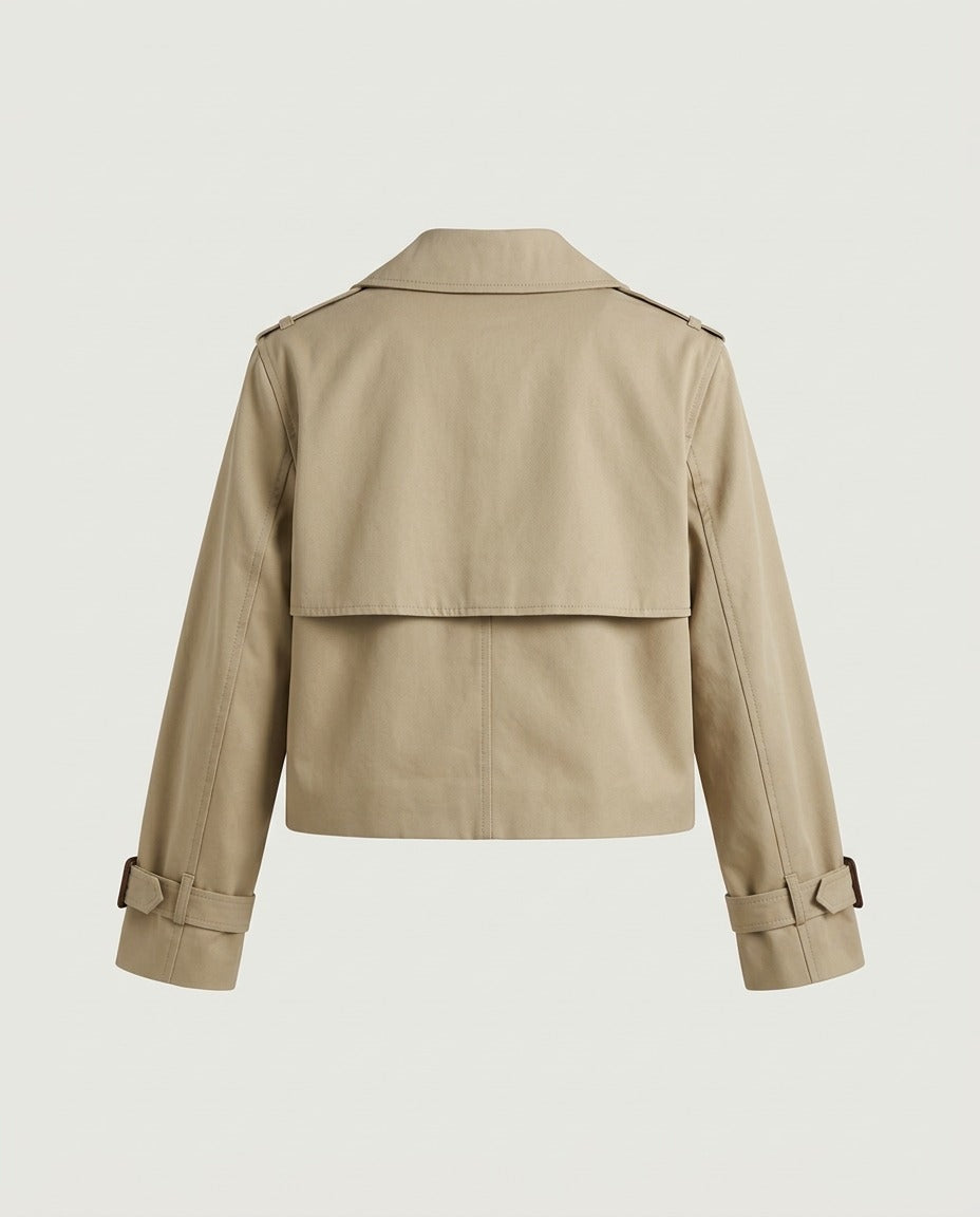 Back view of cropped trench jacket in camel showing clean shoulder line and cropped hem.