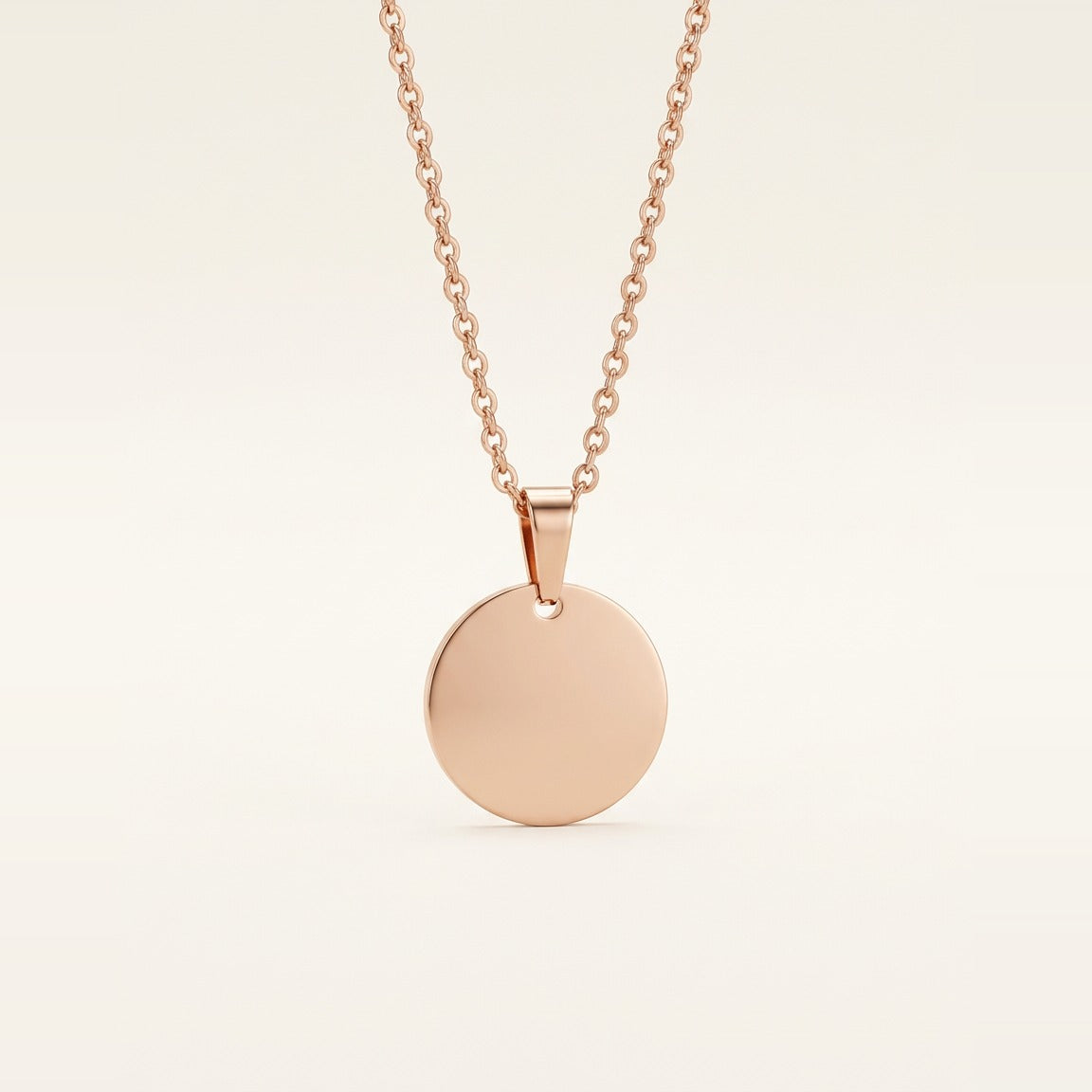 Disc Pendant Necklace in Gold, shown against a dark background.