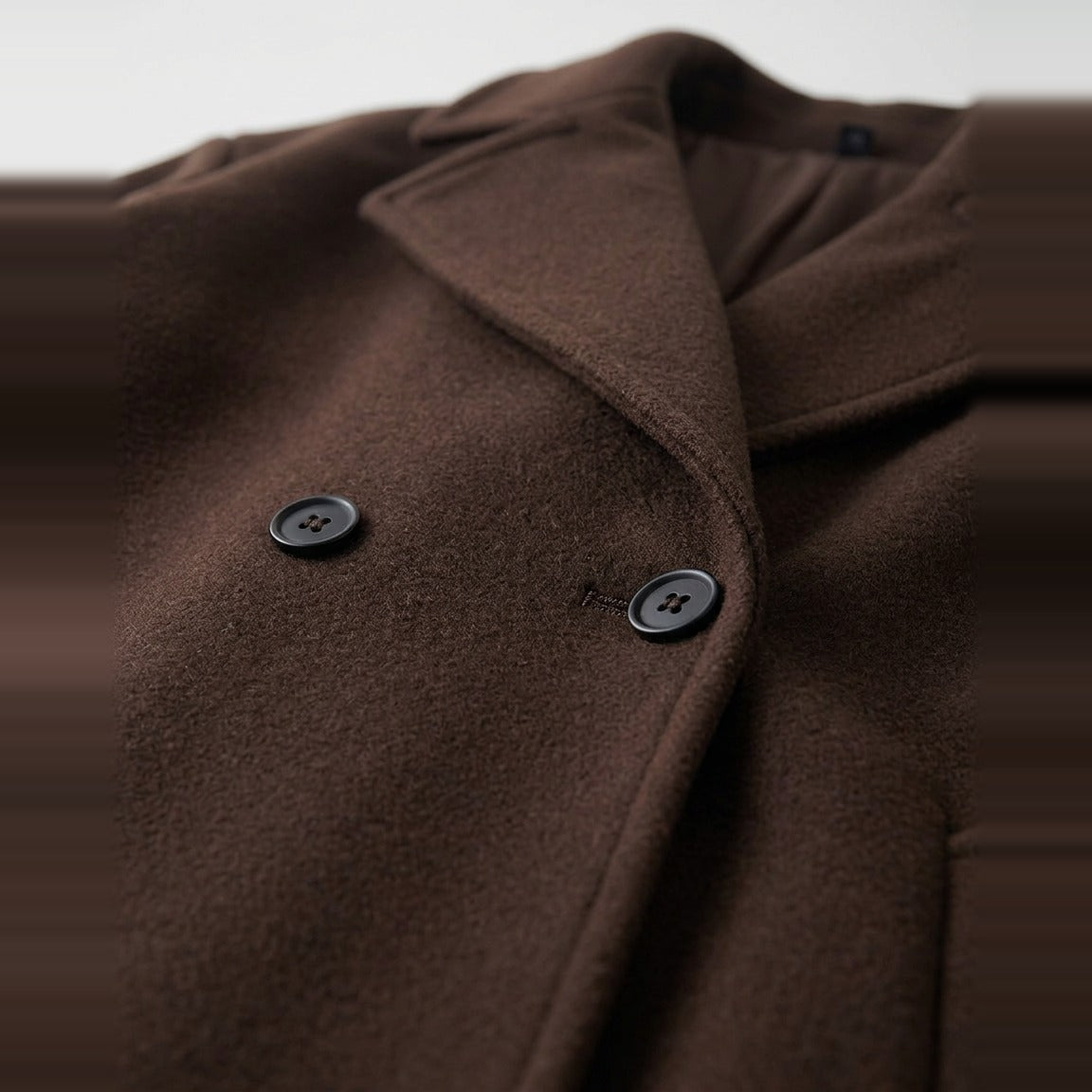 Double-Breasted Coat in Chocolate, peaked lapel and double row of buttons, detail view