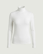 Front view of the fitted long-sleeve turtleneck top in white