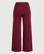 Burgundy jersey trouser, back view, showing smooth silhouette.