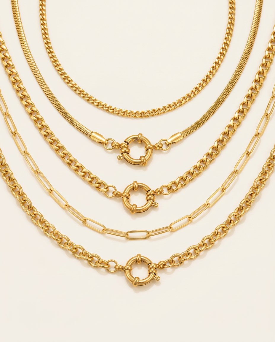 Close-up view of five assorted Gold link necklaces