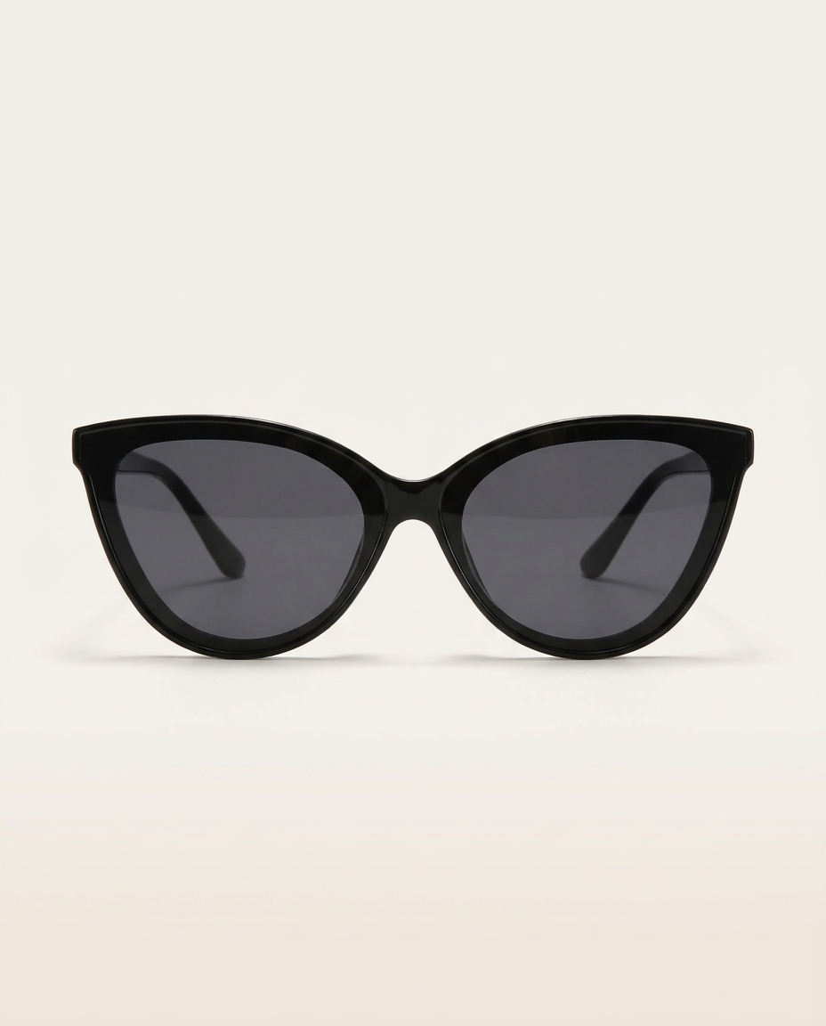 Cat-eye sunglasses in black on an angled plinth.