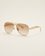 Front view of oversized aviator sunglasses in champagne gold.