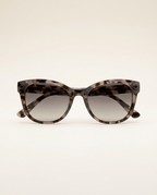 Classic oversized sunglasses in taupe tortoise worn outdoors