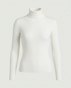 Front view of the ribbed turtleneck sweater in cream.