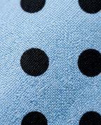 Polka Dot Bomber, black polka dot print on woven fabric close-up