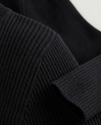 Essential Ribbed Mock Neck Sweater in Black, ribbed shoulder seam and cuff, detail view