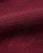 Flared Jersey Trousers in Burgundy, soft jersey knit surface close-up