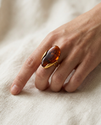High-set Cognac marbled stone ring on the finger.