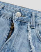 Raw Seam Jeans in Blue, denim waistband with button and frayed raw seam, detail view