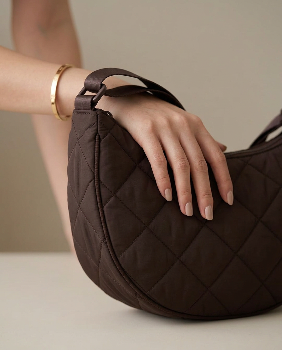 Close-up of the wide strap and the Chocolate quilted finish.