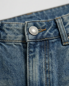 Crystal Wide-Leg Jeans in Blue, mid wash waistband with engraved metal button, detail view