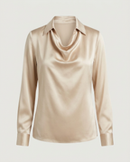 Front view of cream long-sleeved blouse with draped cowl neck and pointed collar
