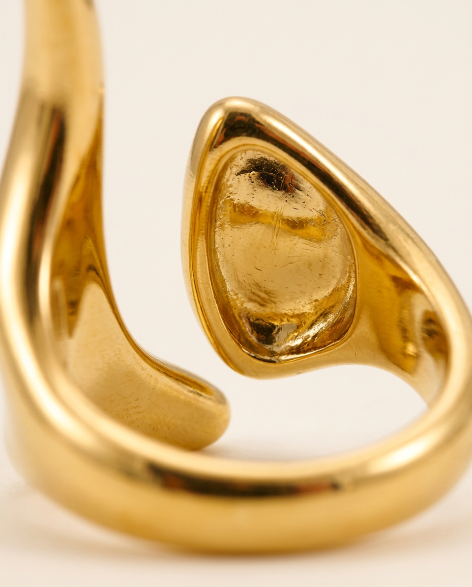 Close-up of the smooth, polished metal surface in Gold.