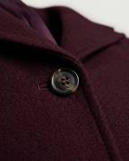 Tailored Maxi Coat in Burgundy, four-hole button and lapel collar, detail view