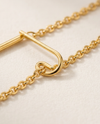 Close-up of the fine chain link in Gold.