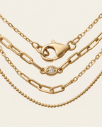 Close-up of the clasp closure on the Gold necklace.