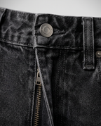 Carpenter Jeans in Black, washed black waistband with metal button and zip fly, detail view