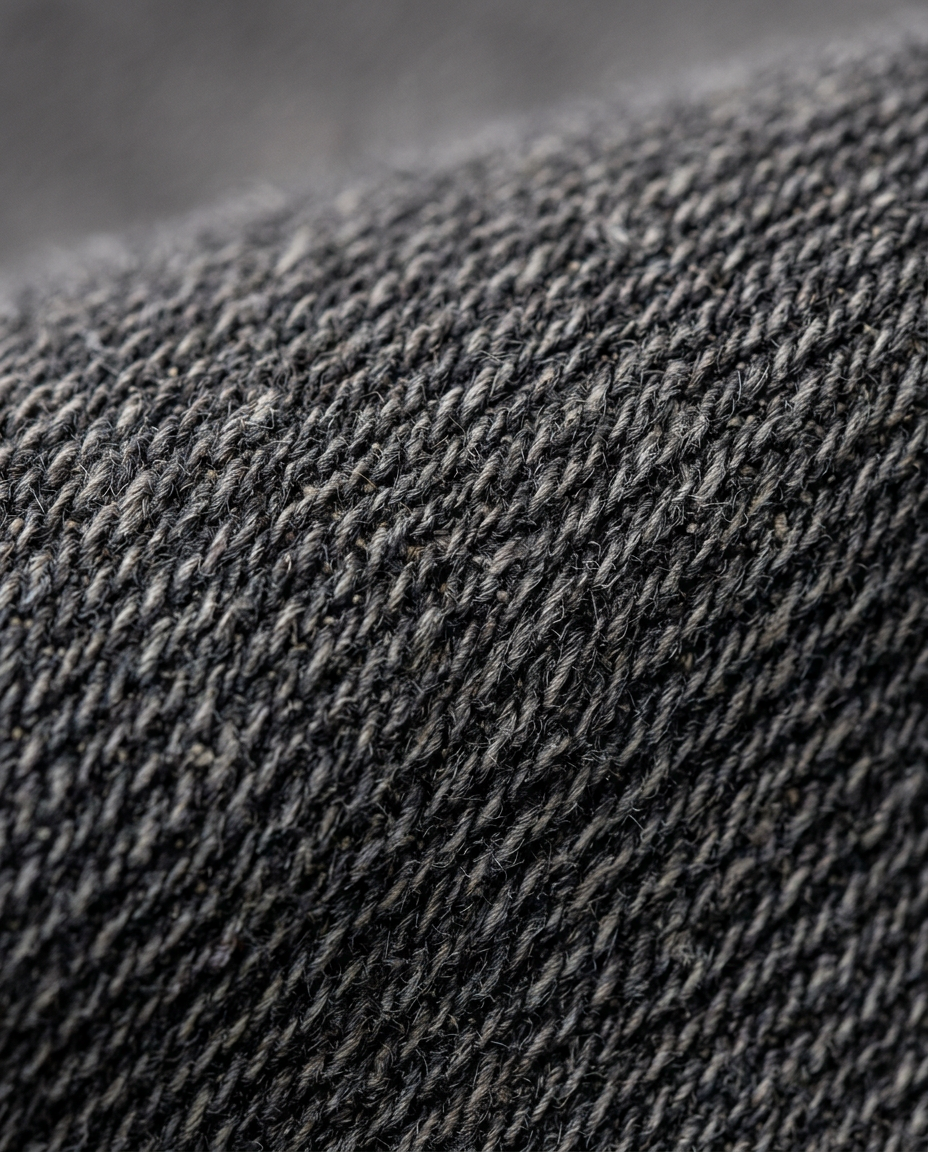 Carpenter Jeans in Black, faded charcoal woven texture close-up