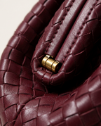 Macro close-up of the woven surface texture in burgundy