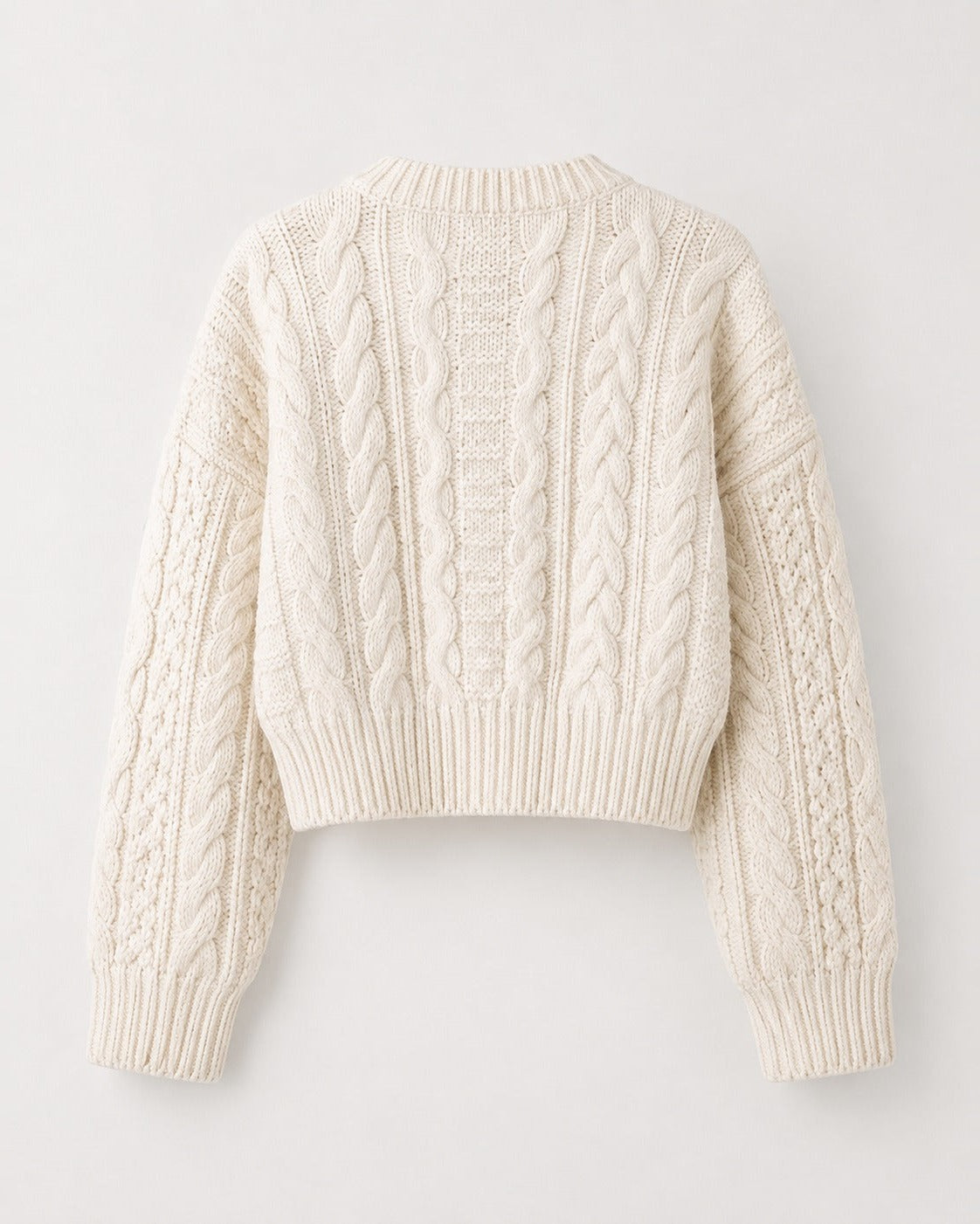 Ribbed knit cardigan showing soft rib texture and button detail, close view