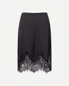 Black satin skirt with scalloped lace hem, front view