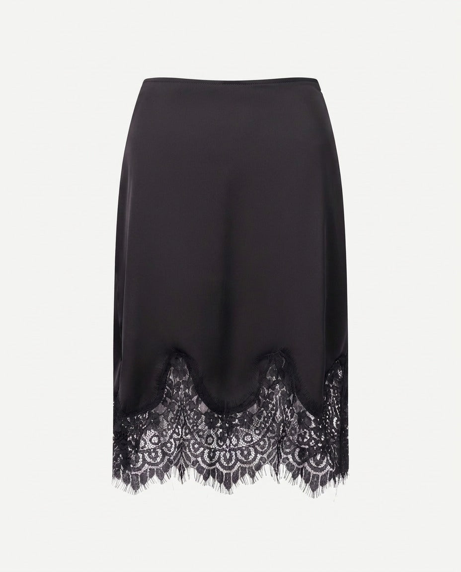 Black satin skirt showing the lace trim at the hem