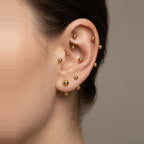 Three sizes of the Gold ball stud earring shown together.