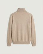 Oatmeal knit jumper showing the ribbed cuff and hem