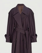 Front view of the oversized belted trench coat in burgundy.