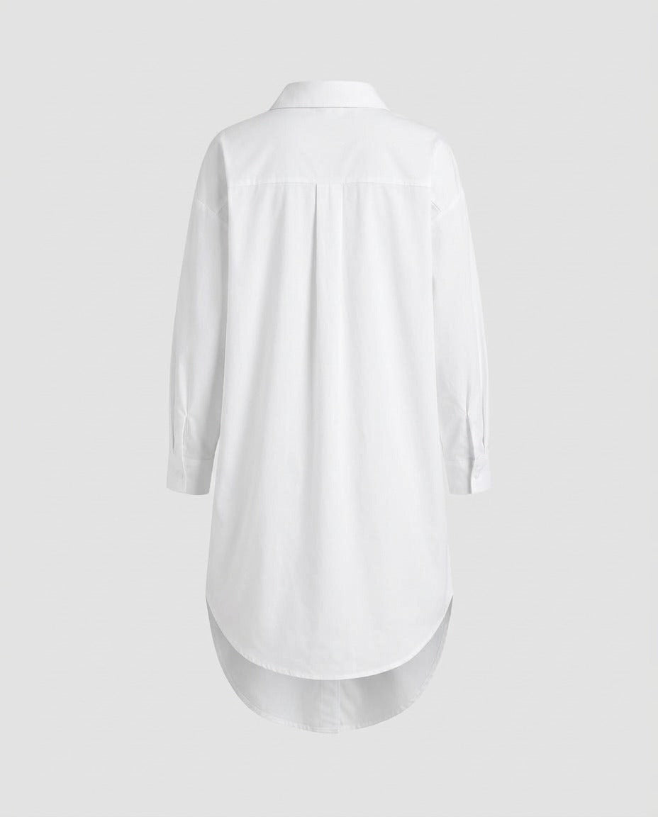 White shirtdress silhouette showing the curved hemline