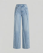 Patchwork straight-leg jeans with contrasting mixed-wash denim panels, front view