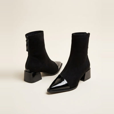Patent Cap Toe Stretch Bootie in Black, showing the sharp silhouette.