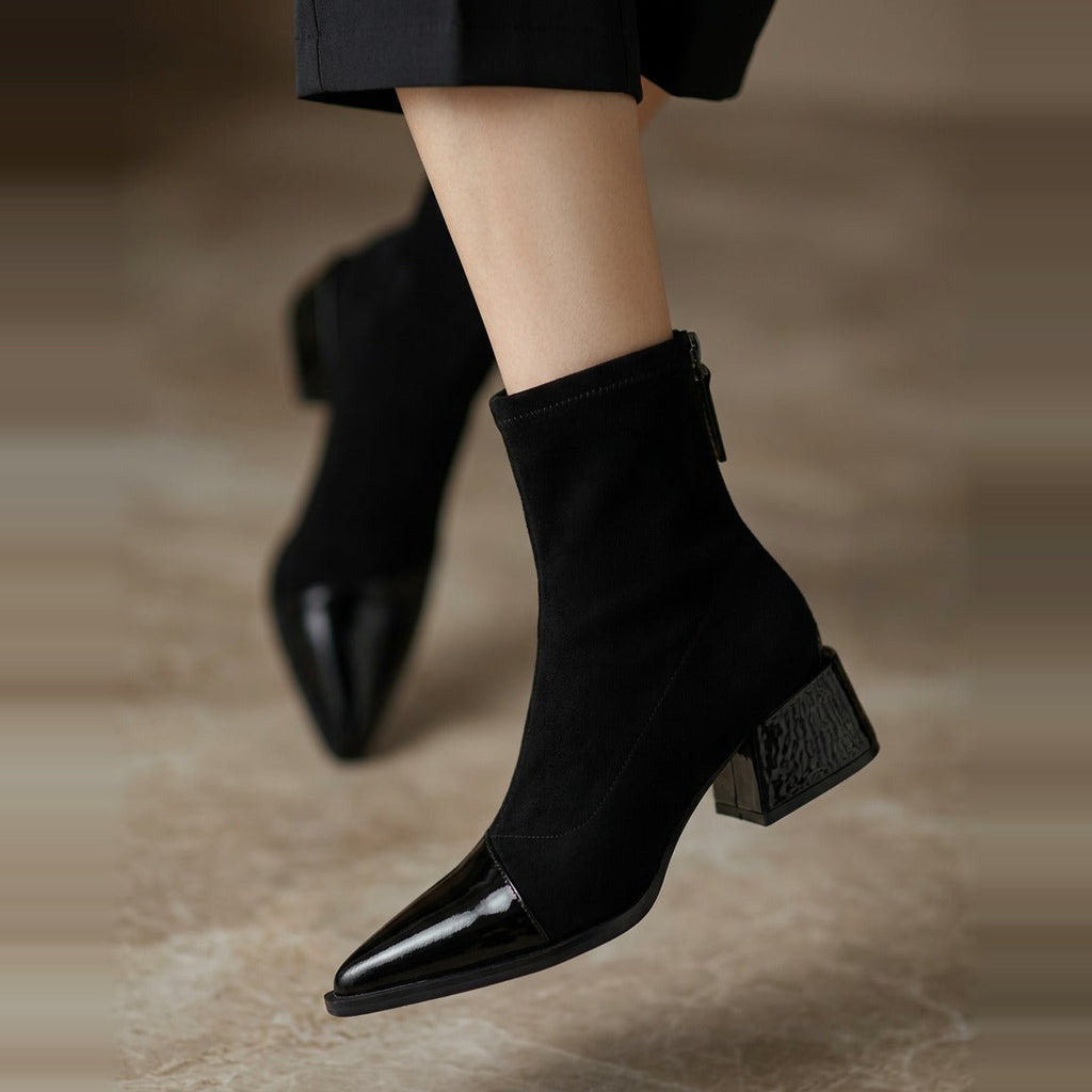 Close-up of the ankle shaft and rear zipper closure in Black.