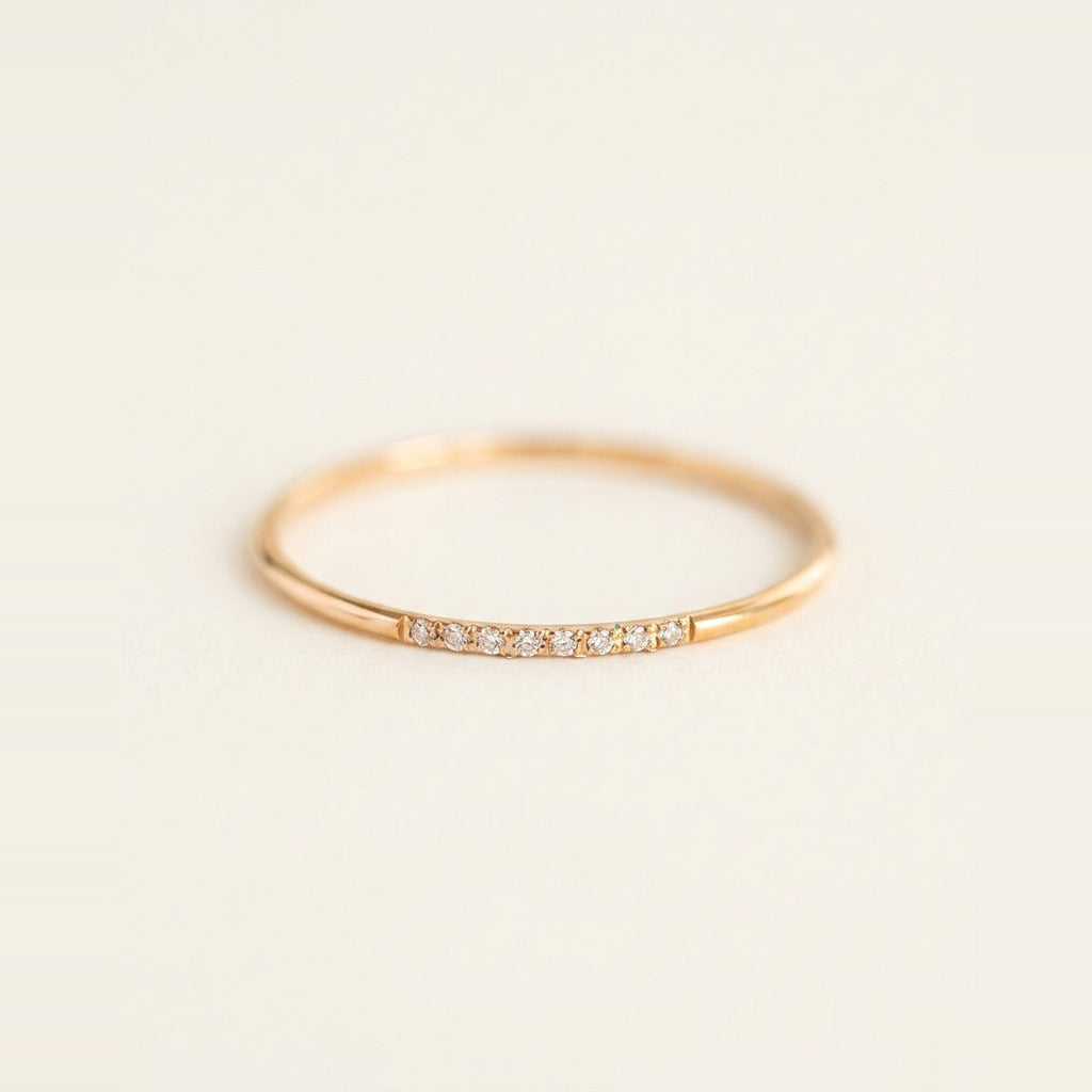 Pave Stacking Ring in Gold, shown on a ring stand.