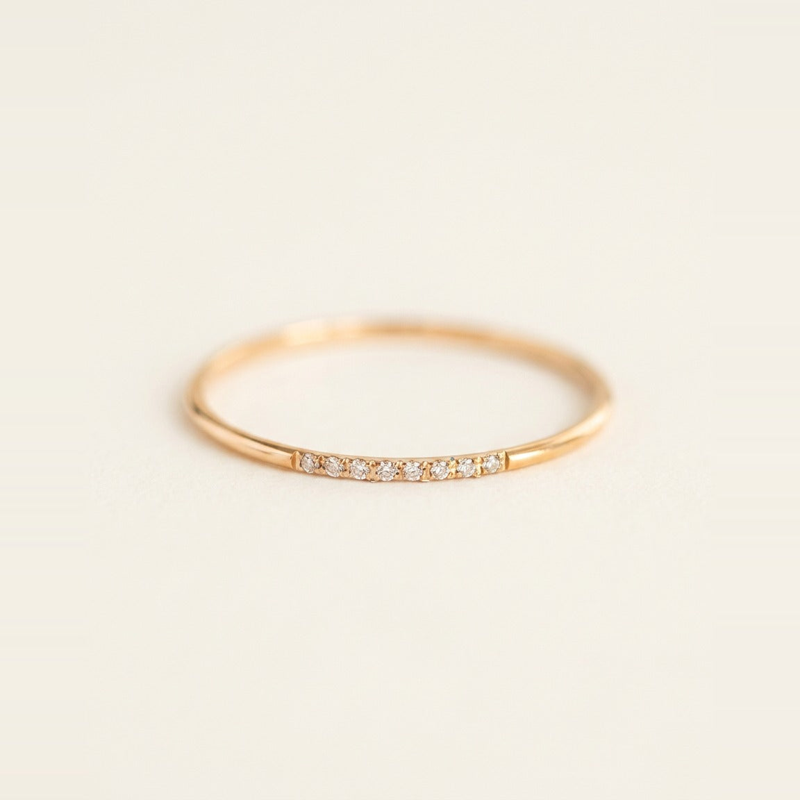 Pave Stacking Ring in Gold, shown on a ring stand.