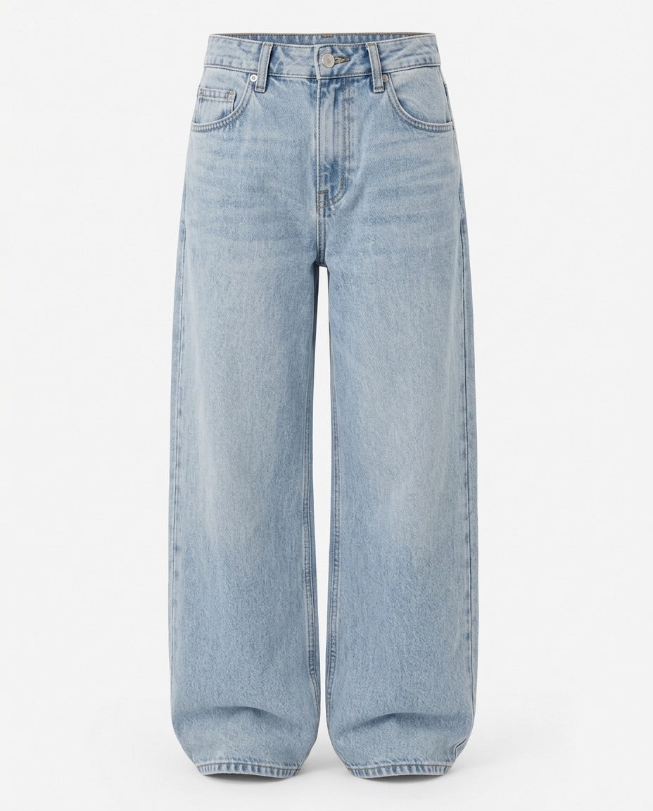 Relaxed wide leg denim trouser in Washed Blue, shown on model.