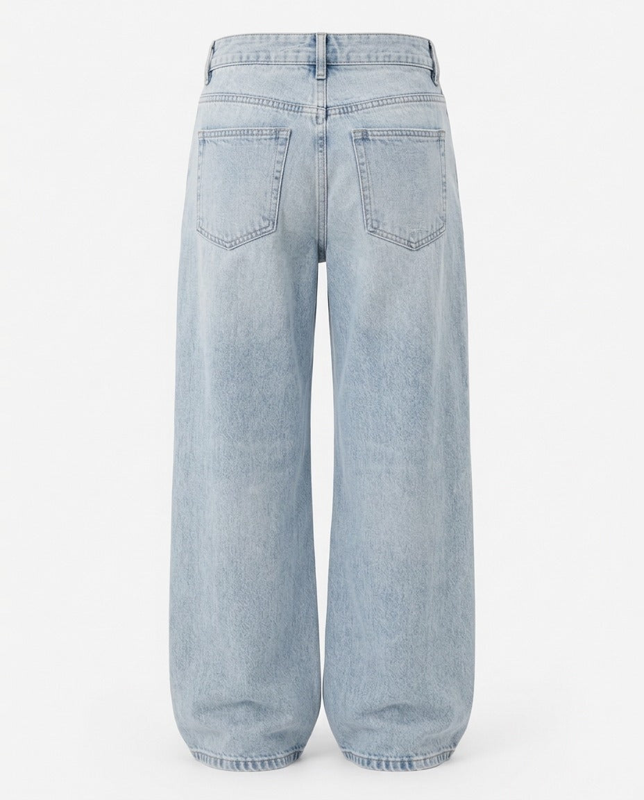 Relaxed wide leg denim trouser in Washed Blue, showing back pocket placement.